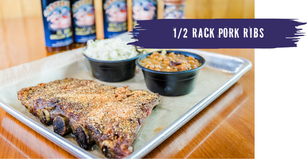 ½ rack pork ribs on a tray with coleslaw and beans